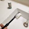 Foaming effect of powdered toothpaste on the toothbrush